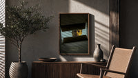 Se7en box scene poster framed above a fluted sideboard beside an olive tree