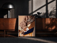 Black-framed Black Woman in a Brown Crewneck print on the floor in front of a dark wooden console