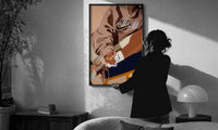 Black Woman in a Brown Crewneck print in a slim black frame being hung on a sunlit wall in a monochrome room