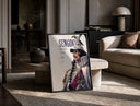 Marine fleet admiral in white uniform print in a black frame leaning on a travertine table in a sunlit lounge