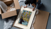 Seven Cups of Wands tarot card framed print being unpacked from protective bubble wrap and a box
