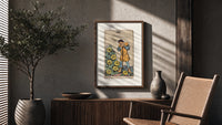 Man leaning on staff with pentacles poster framed above a fluted sideboard beside an olive tree