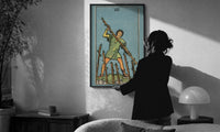 Seven of Wands print in a slim black frame being hung on a sunlit wall in a monochrome room