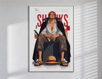 Red-haired man sitting on block poster in a slim frame on a bright wall with soft window light