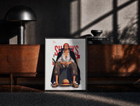 Black-framed Red-haired man sitting on block print on a moody console with designer coffee-table books