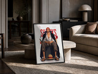 Red-haired man sitting on block print in a black frame leaning on a travertine table in a sunlit lounge