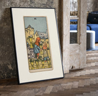 Two children exchanging cups of flowers print in a black frame leaning beside a vintage door on parquet