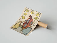 Gently curled Six of Pentacles print beside its protective shipping tube