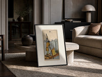 Ferryman poling boat with swords print in a black frame leaning on a travertine table in a sunlit lounge
