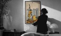 Six of Swords print in a slim black frame being hung on a sunlit wall in a monochrome room