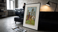 Rider on white horse with staff print in a slim black frame leaning on a dark sofa in a concrete print studio