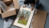 Rider on white horse with staff framed print being unpacked from protective bubble wrap and a box