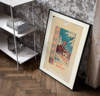 Christmas carollers with star in snowy village poster in a black frame leaning beside a shelf in a raw-plaster loft