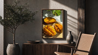 Sliced Mango poster framed above a fluted sideboard beside a potted tree