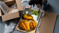 Sliced Mango framed print being unpacked from protective bubble wrap and a box