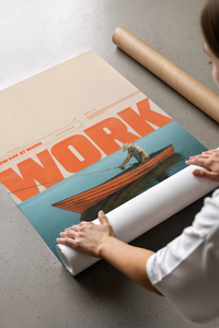 Person unrolling the orange fisherman on boat poster across a grey concrete floor