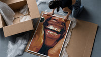 Framed Grillz Smile framed print being unpacked from protective bubble wrap and a box