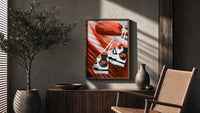 Sneakers Hanging from a Car Mirror poster framed above a fluted sideboard beside a potted tree