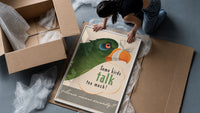 Some Birds Talk Too Much framed print being unpacked from protective bubble wrap and a box