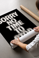 Bold typographic poster with glitched text effect print laid flat in a styling flatlay