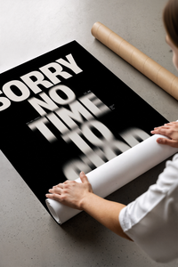 Bold typographic poster with glitched text effect print laid flat in a styling flatlay