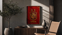 Spain national football crest emblem poster framed above a fluted sideboard beside an olive tree