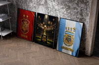 FIFA World Cup 2026 Final trophy and crests set of three black-framed prints leaning against a raw-plaster wall