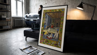 Renaissance children playing indoors print in a slim black frame leaning on a dark sofa in a concrete print studio