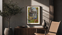 Alchemist tending fire beneath fountain poster framed above a fluted sideboard beside an olive tree
