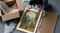 Crowned angelic woman and red-skinned man framed print being unpacked from protective bubble wrap and a box