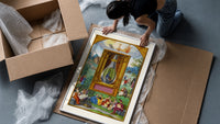 Peacock inside glass alchemical vessel framed print being unpacked from protective bubble wrap and a box