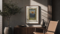 Sun with human face over town poster framed above a fluted sideboard beside an olive tree