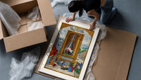 Alchemical flask with birds inside framed print being unpacked from protective bubble wrap and a box