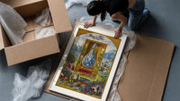 Crowned double-headed bird in flask framed print being unpacked from protective bubble wrap and a box