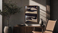 Stacked Brown and Cream Sneakers poster framed above a fluted sideboard beside a potted tree