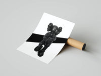 Right panel with a seated black KAWS Companion figure and Nike Swoosh completing the monochrome triptych