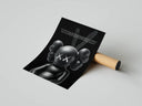 Standing KAWS Companion with glowing XX eyes on black poster partially unrolled from a tube