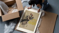 Flamenco dancer with flowers in hair framed print being unpacked from protective bubble wrap and a box