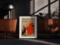 Black-framed Girl in red dress drinking from bowl print on a moody console with designer coffee-table books