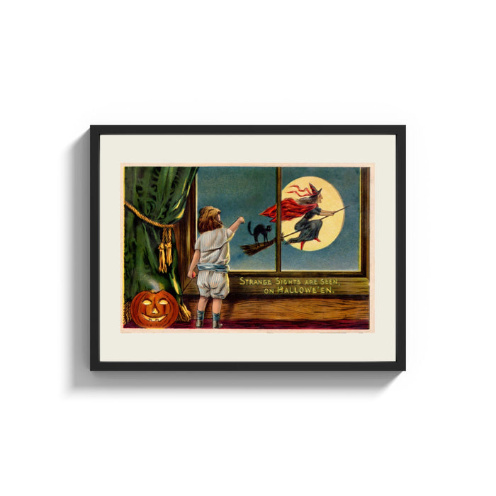 Framed Child watching witch fly past window print shown as a wide statement piece on a clean white wall
