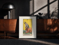 Black-framed Woman taming a lion print on a moody console with designer coffee-table books