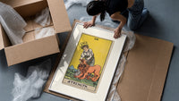 Woman taming a lion framed print being unpacked from protective bubble wrap and a box
