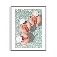 Aerial view of three women on pink pool floats in turquoise water – summer pool wall art print