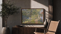 Sunlit garden path by cottage print in a wood frame above a fluted sideboard beside an olive tree