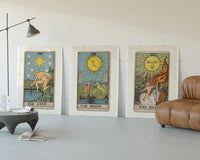 Three 1909 tarot cards three-panel set displayed beside a brown leather sofa