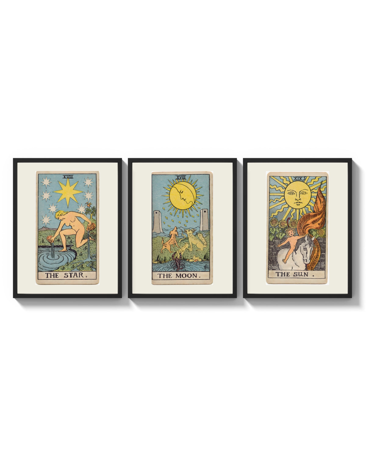 Three 1909 tarot cards arranged on a bright gallery wall