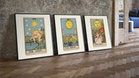 Three 1909 tarot cards three-piece set leaning on parquet beside a vintage loft door