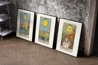 Three 1909 tarot cards set of three black-framed prints leaning against a raw-plaster wall