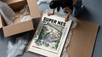 Super Nintendo game console with controller framed print being unpacked from protective bubble wrap and a box