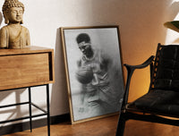 Brass-framed Basketball player celebrating with ball print leaning in a warm styled corner by a sculpture